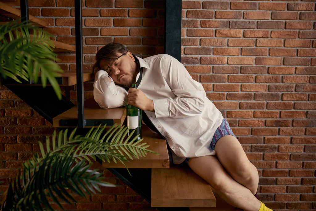 Depressed drunken businessman freelancer suffering from professional crisis